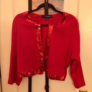 Red bolero with sequin trim.